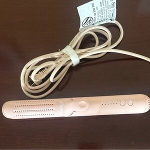 Pink Hair Styling Tool with Control Buttons